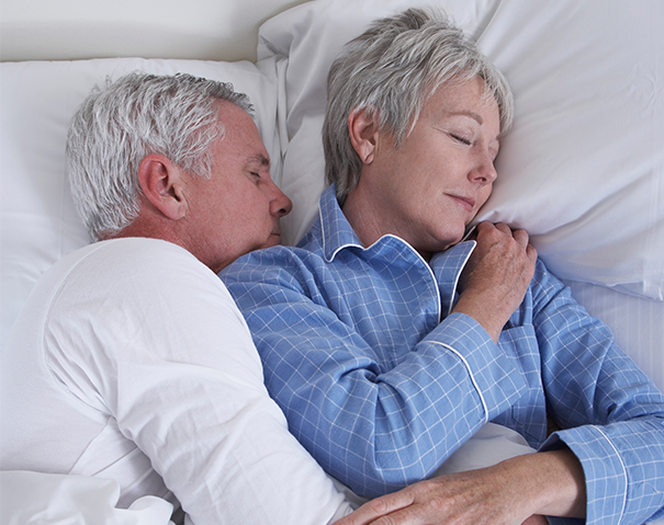 Oder couple sleeping in bed