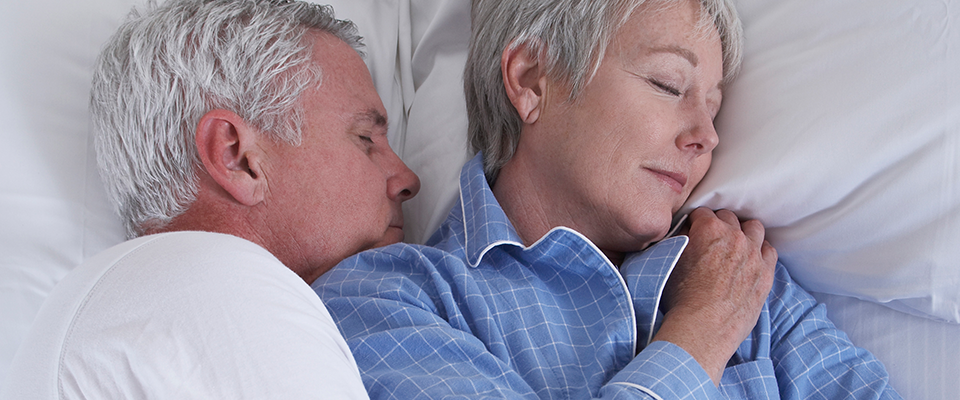 Oder couple sleeping in bed