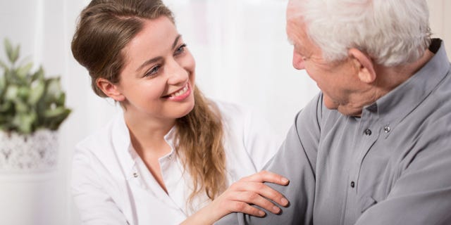 Caregiver Chatting to Resident